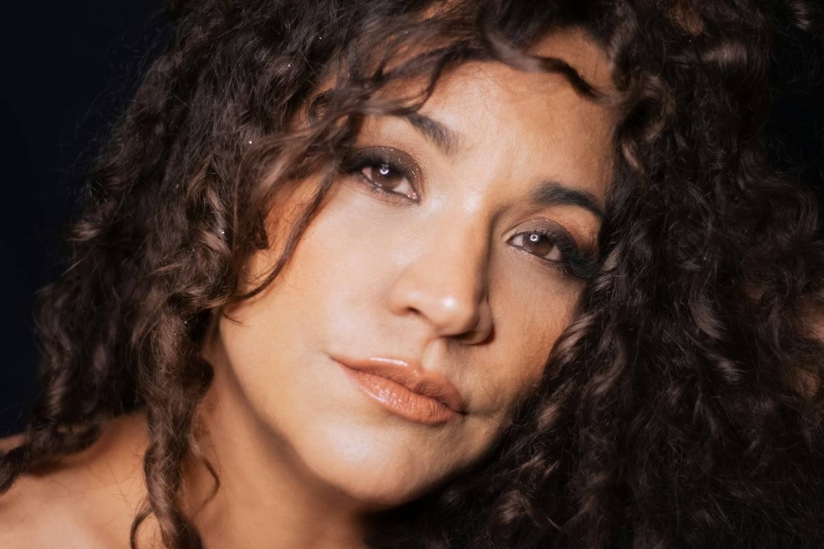 Woman holding damaged hair after using wrong rollers